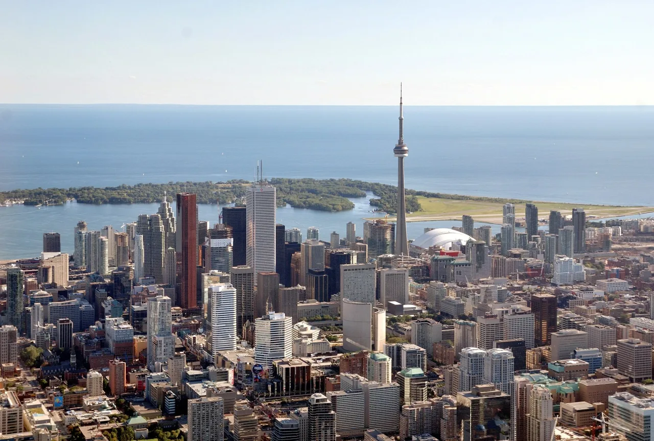 Aerial view of the Toronto skyline with the CN Tower, downtown towers and the lake behind.