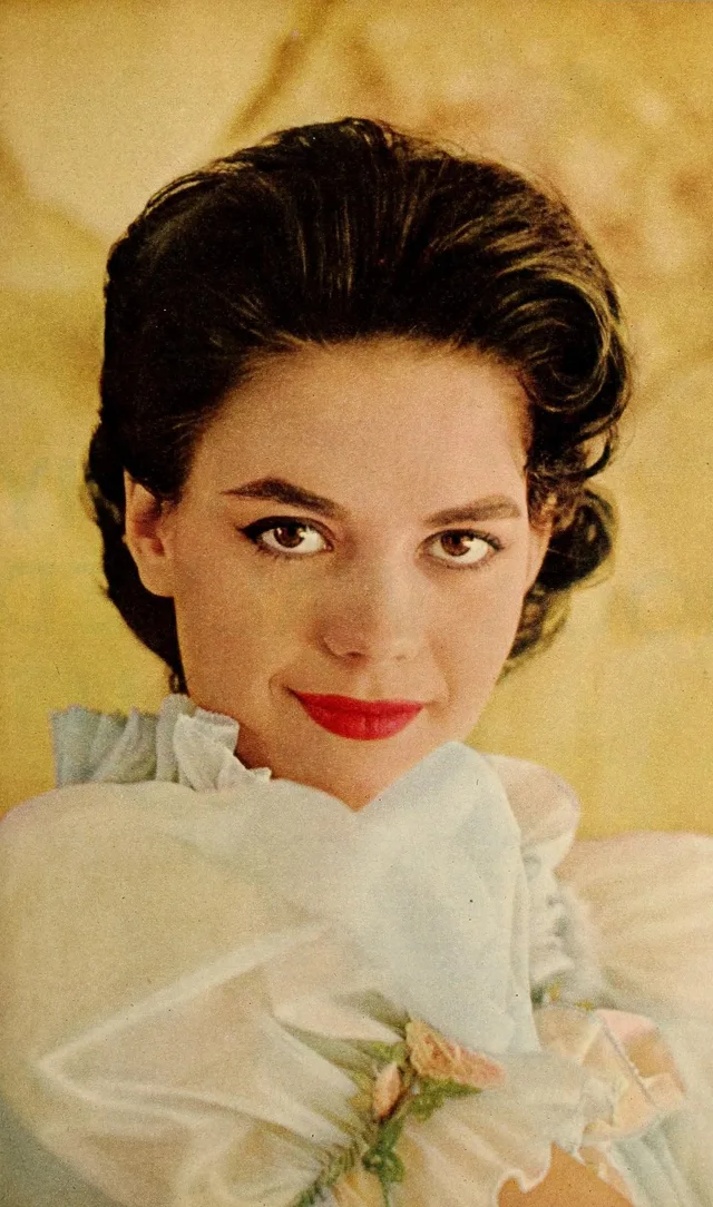 Black-and-white magazine portrait of Natalie Wood from 1958, smiling.