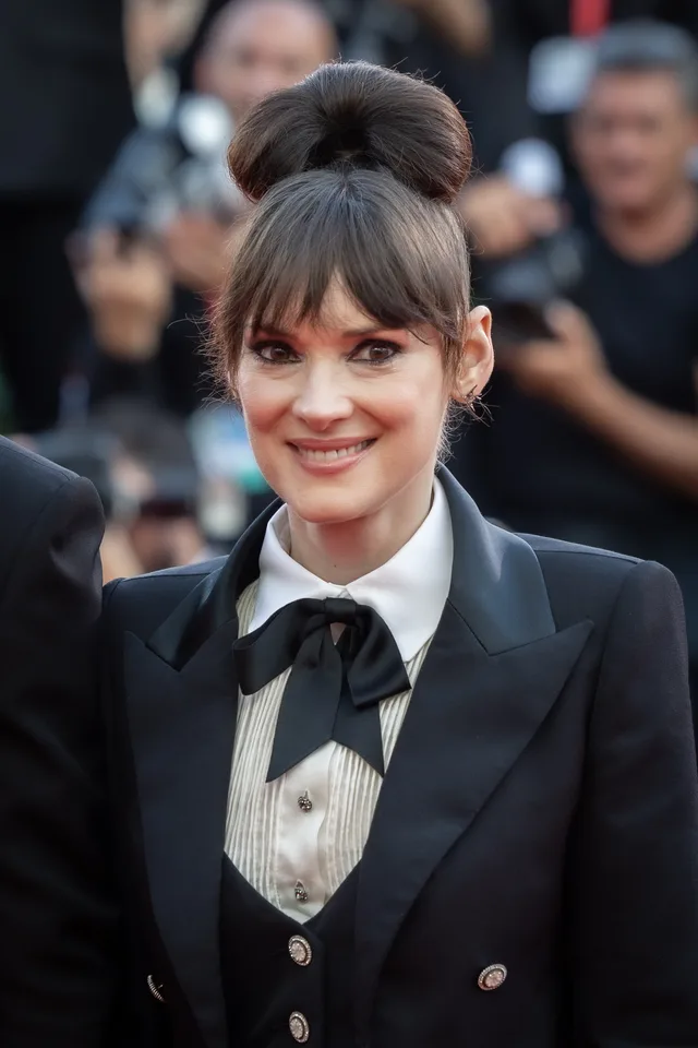 Winona Ryder at a public event, looking towards the camera.