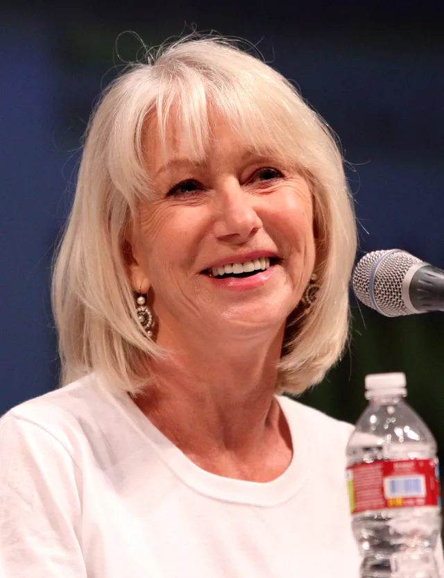 Portrait photograph of the actor Helen Mirren at a fan convention panel.