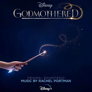 A hand holds a glowing wand against a deep navy sky, trailing a loop of golden sparkles, with the album title in silver letters above.