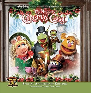 Album cover showing a group of puppet figures in Victorian winter clothes gathered at a snowy window framed with holly and berries, with a green banner along the bottom.