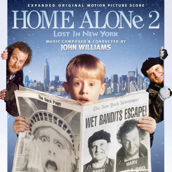 Score album cover on a snowy blue city skyline, with a boy holding up a newspaper and two men peeking in from either side.