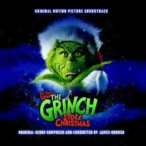 Album cover showing a green-furred creature in a white-trimmed red hat against a snowy night sky, with the film title in white lettering below.