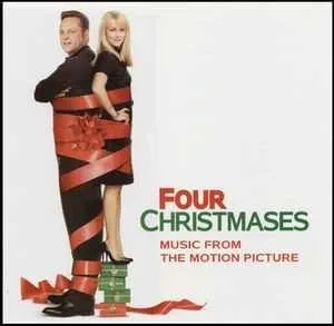 Album cover showing a man and a woman standing back to back, wrapped together in a wide red ribbon, with wrapped gifts at their feet and the film title in green and red type.