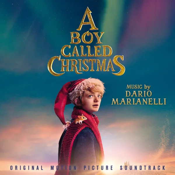 Album cover with gold lettering over a colourful aurora sky, showing a young boy in a red knitted hat and scarf with a small mouse on his shoulder.