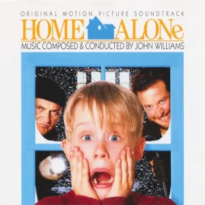 Album cover showing a wide-eyed boy with hands on his cheeks in a blue window frame, two men peering in behind him through snowy panes, with the film title in orange letters above.